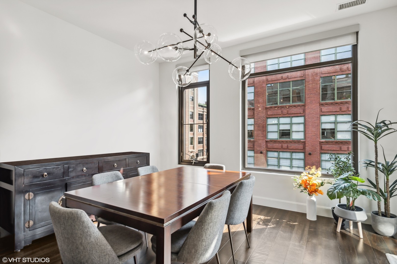 40 North Carpenter Street, Unit 4S Chicago, IL 60607 - Photo 8 of 25 a view of a dining room with furniture window and wooden floor