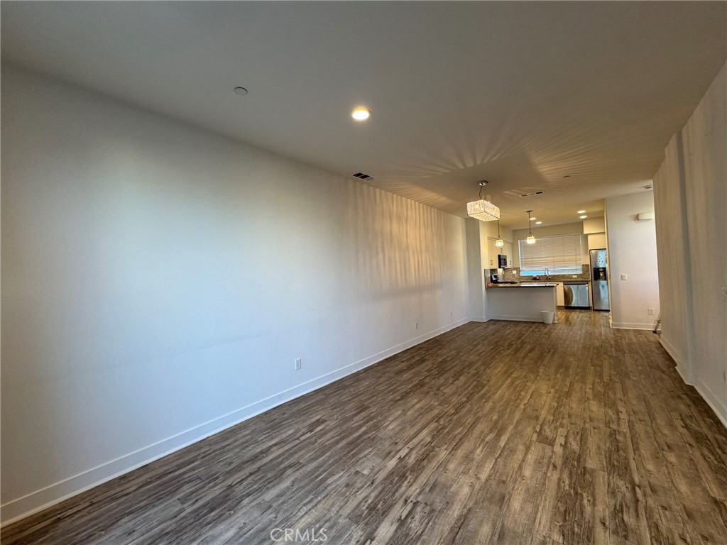 9042 Garvey Avenue, Unit 16 Rosemead, CA 91770 - Photo 23 of 28 a view of an empty room and a kitchen