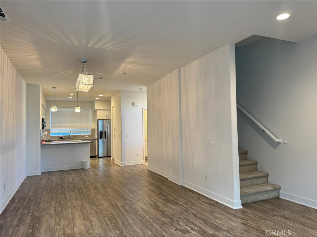 9042 Garvey Avenue, Unit 16 Rosemead, CA 91770 - Photo 24 of 28 a view of entryway and hall with wooden floor