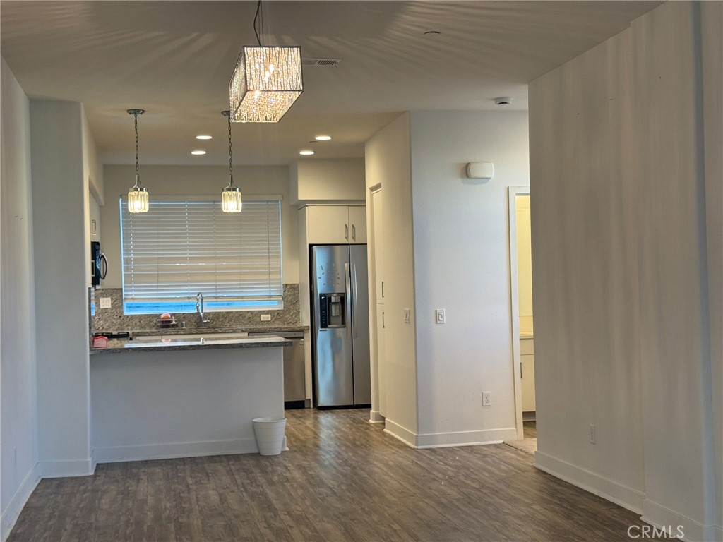 9042 Garvey Avenue, Unit 16 Rosemead, CA 91770 - Photo 26 of 28 a kitchen with stainless steel appliances a refrigerator and a sink