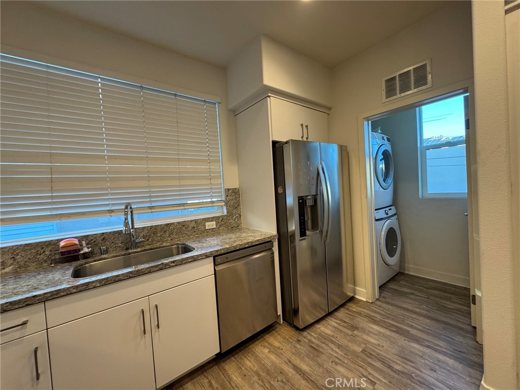 9042 Garvey Avenue, Unit 16 Rosemead, CA 91770 - Photo 28 of 28 a kitchen with stainless steel appliances granite countertop a refrigerator and a sink