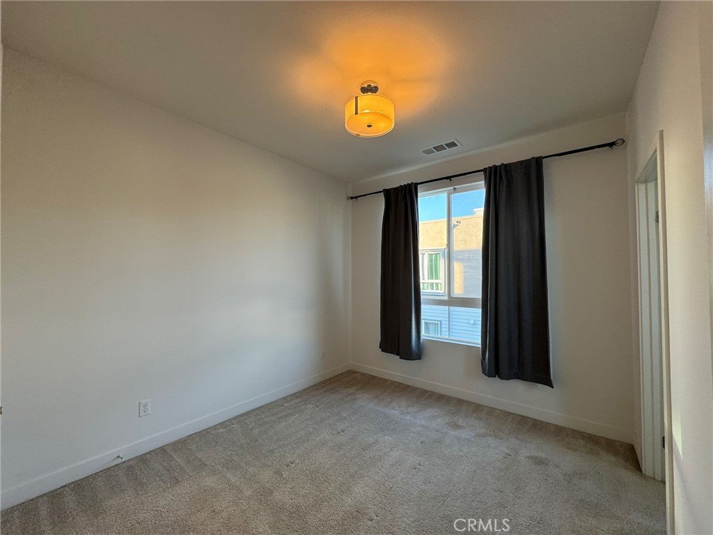 9042 Garvey Avenue, Unit 16 Rosemead, CA 91770 - Photo 6 of 28 a view of an empty room with a window
