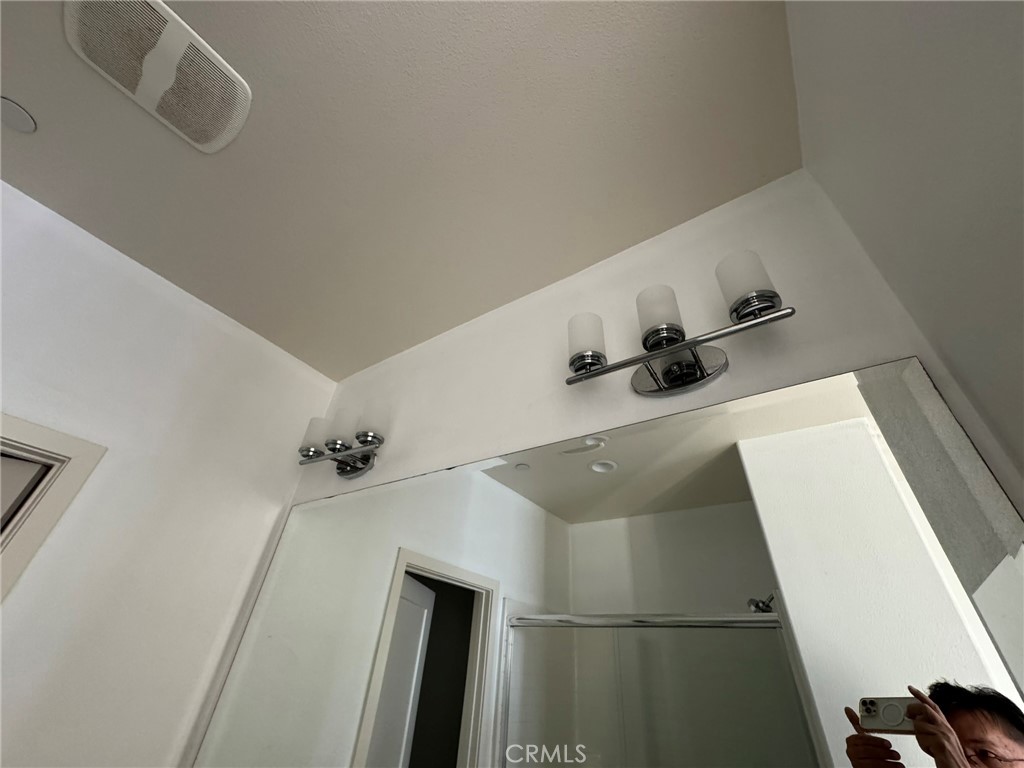 9042 Garvey Avenue, Unit 16 Rosemead, CA 91770 - Photo 7 of 28 a bathroom with a sink and mirror