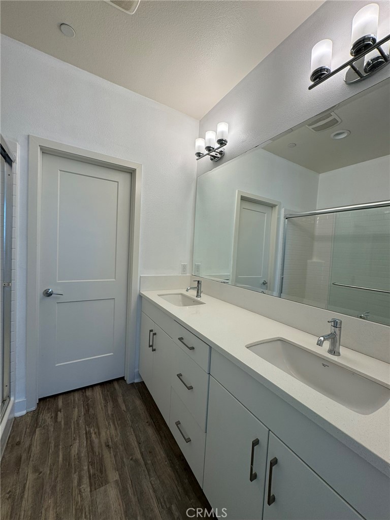 9042 Garvey Avenue, Unit 16 Rosemead, CA 91770 - Photo 8 of 28 a spacious bathroom with a double vanity sink and mirror