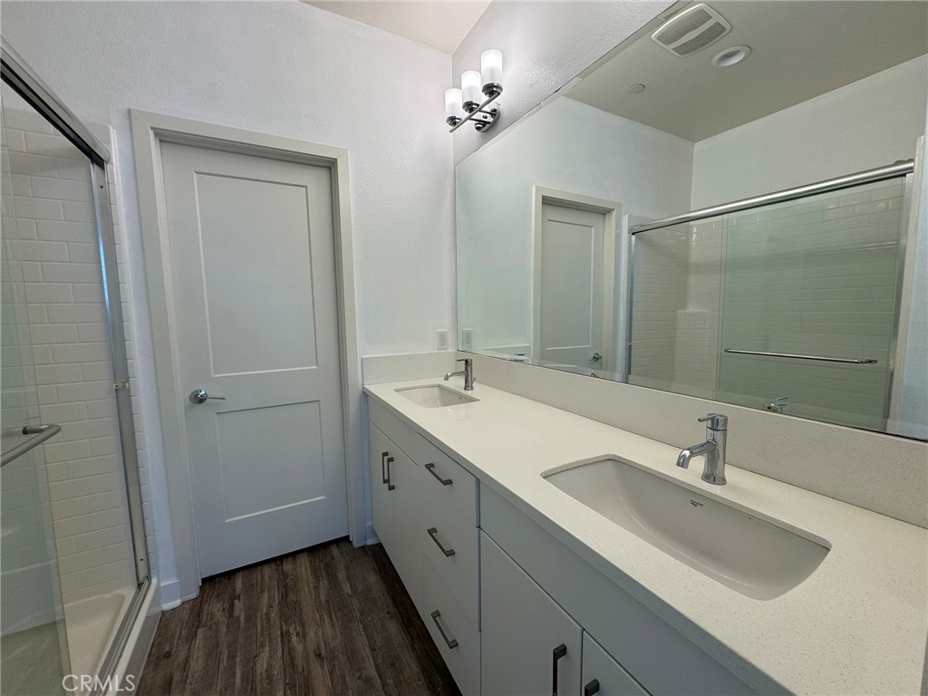 9042 Garvey Avenue, Unit 16 Rosemead, CA 91770 - Photo 9 of 28 a spacious bathroom with a double vanity sink a mirror and a shower