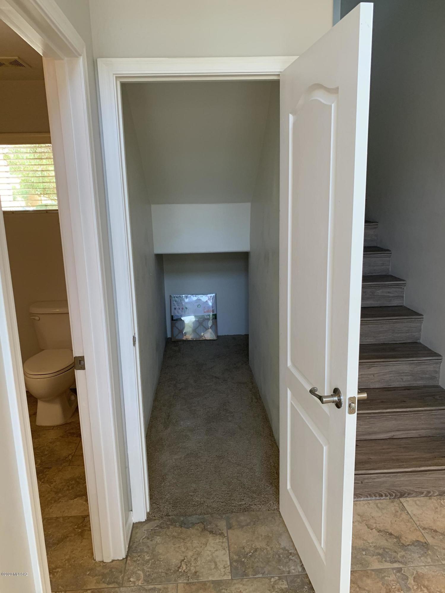 4181 North Fortune Loop Tucson, AZ 85719 - Photo 19 of 39 a view of a hallway with wooden floor and staircase
