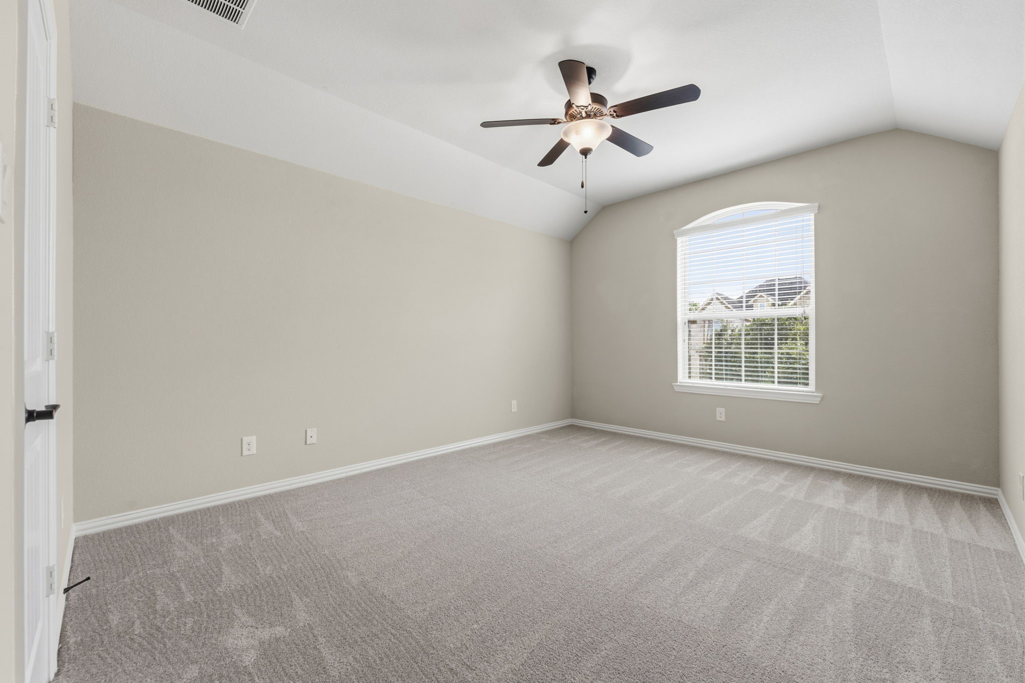 25210 Gaddis Oaks Drive Spring, TX 77389 - Photo 35 of 50 an empty room with windows and fan