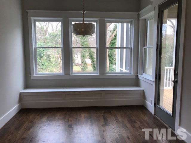 902 Norris Street Raleigh, NC 27604 - Photo 11 of 25 Built in Bench Seating with Storage. Looks over backyard with Trees and Connects to Screened in Porch.