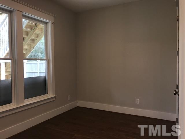902 Norris Street Raleigh, NC 27604 - Photo 20 of 25 Hardwood floors throughout the basement level. Full bath at the basement level.