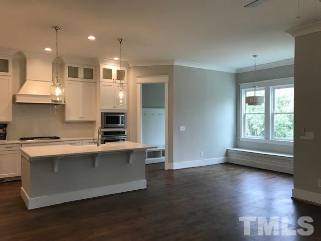902 Norris Street Raleigh, NC 27604 - Photo 9 of 25 Gourmet Kitchen with Cabinets to the Ceiling. Quartz Counter Tops
