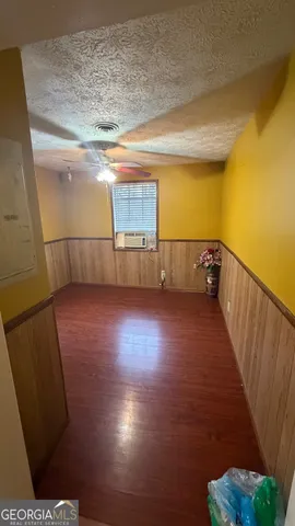 a view of a livingroom with wooden floor