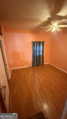 a view of living room with furniture and a fireplace