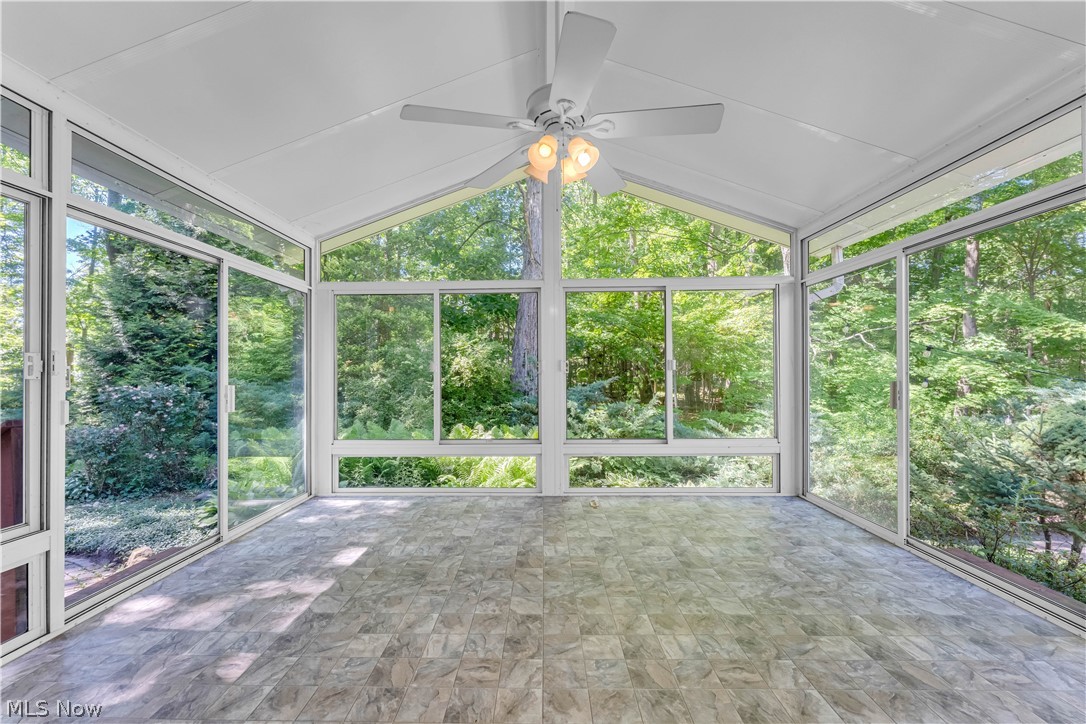 6821 Thornapple Road Gates Mills, OH 44040 - Photo 32 of 42 Screened-in porch featuring a vaulted ceiling and a ceiling fan with integrated lighting