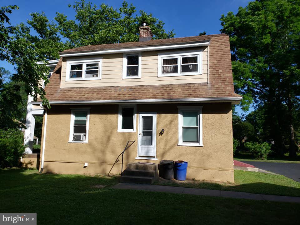 a house that has tree in front of it