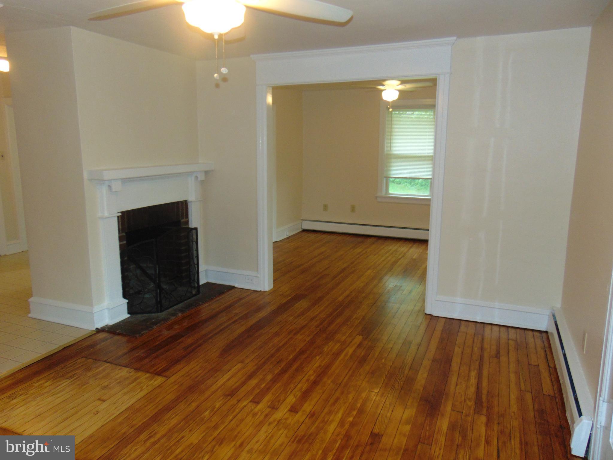 1311 Bristol Road, Unit 1 Churchville, PA 18966 - Photo 7 of 13 wooden floor fireplace and natural light in room