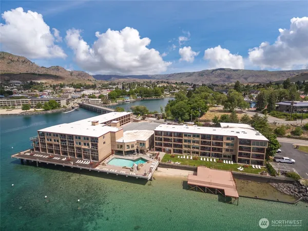 an aerial view of a house with lake view and city view