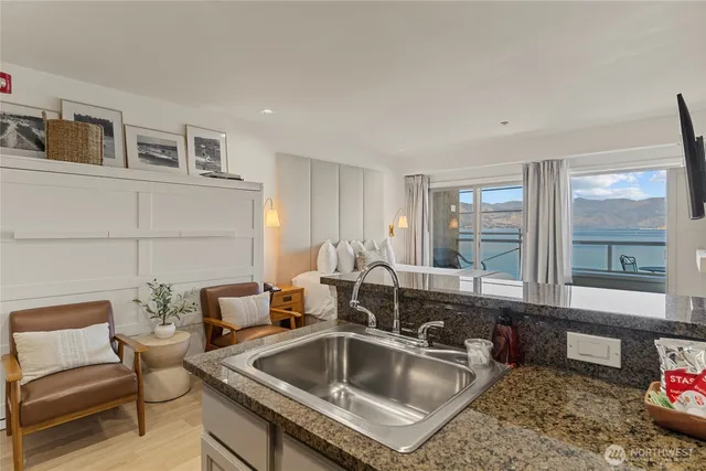 a kitchen with a sink and a refrigerator