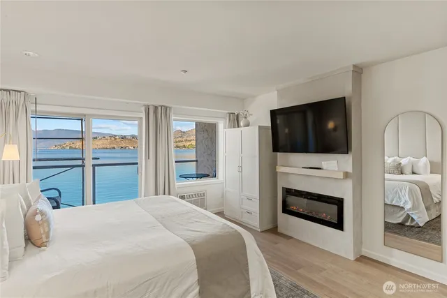 a bedroom with a bed and a television