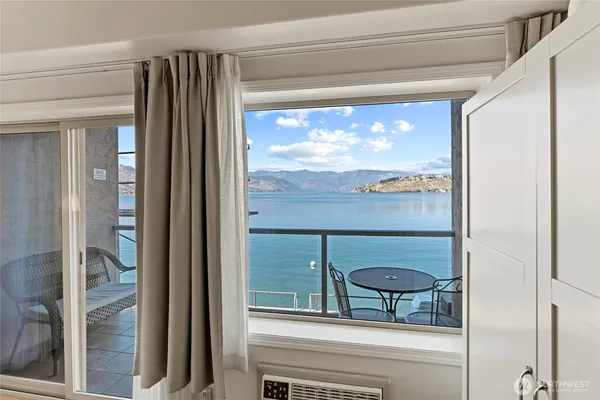 a view of a glass door and a window