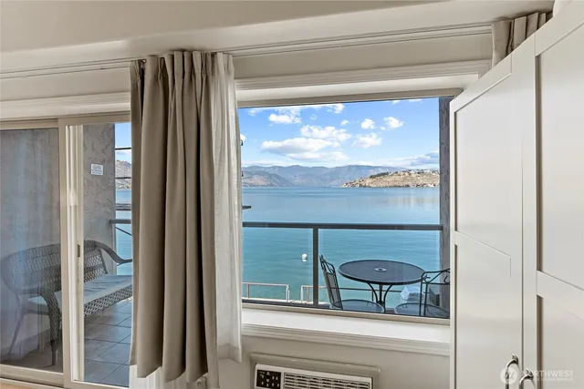 a view of a glass door and a window