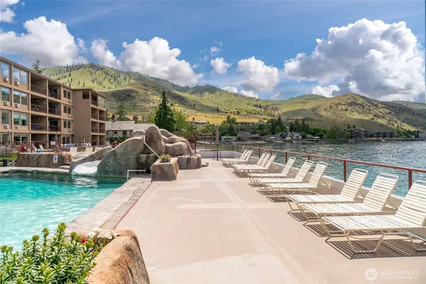 a view of a swimming pool with a patio