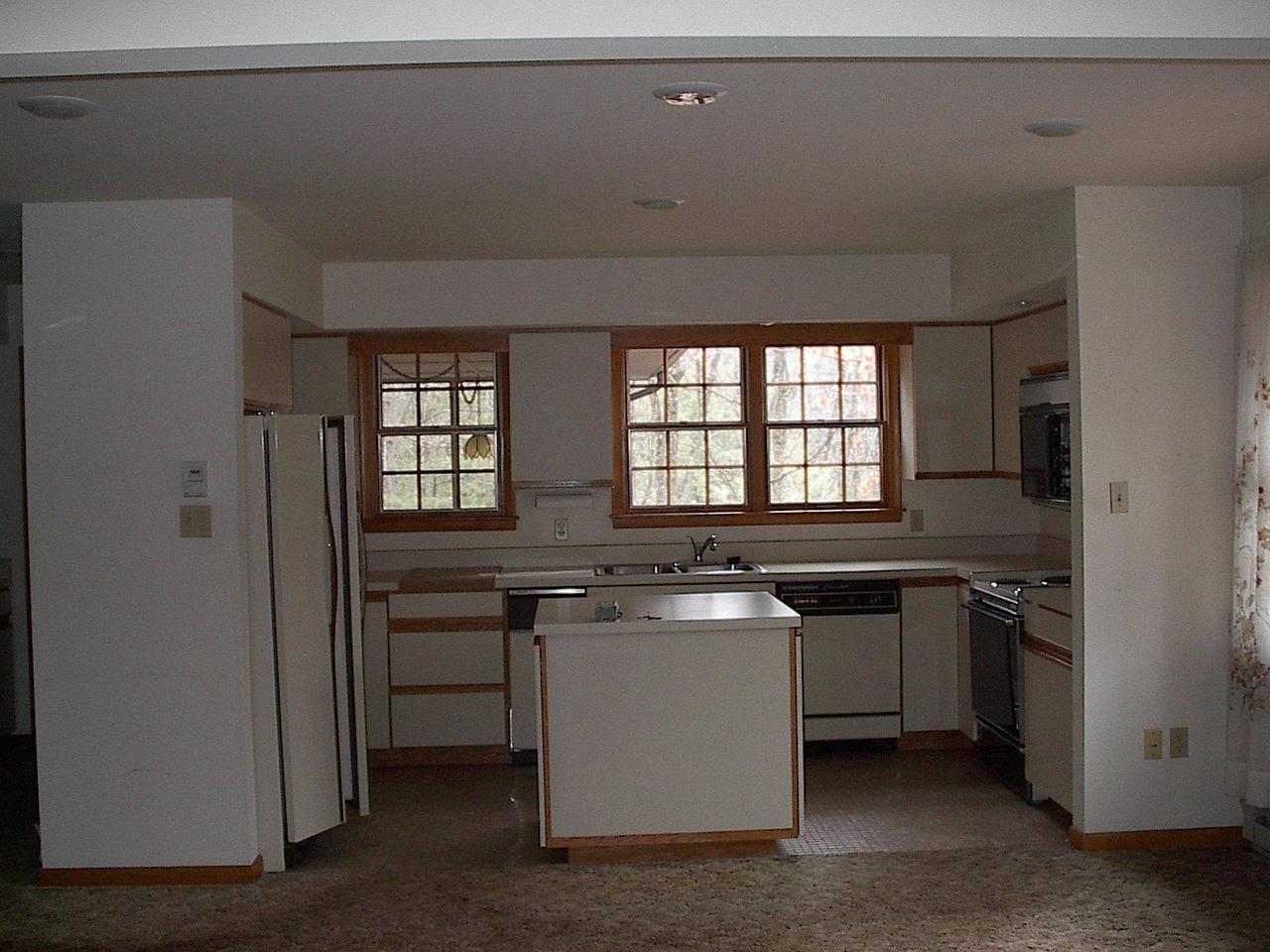 406 Cays Road Stroudsburg, PA 18360 - Photo 3 of 4 a kitchen with stainless steel appliances granite countertop a sink and a stove