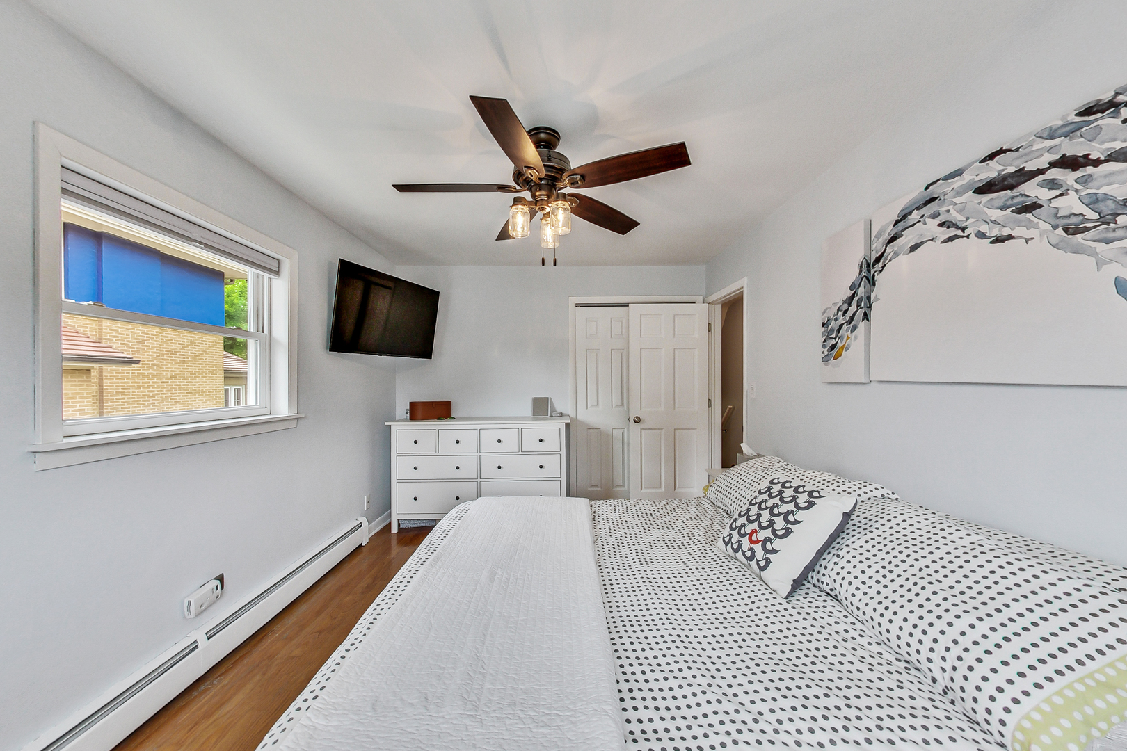 3609 North Harding Avenue Chicago, IL 60618 - Photo 15 of 41 a bedroom with a bed and a flat screen tv