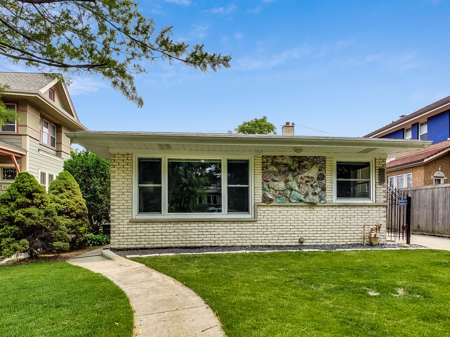 3609 North Harding Avenue Chicago, IL 60618 - Photo 2 of 41 a front view of a house with garden