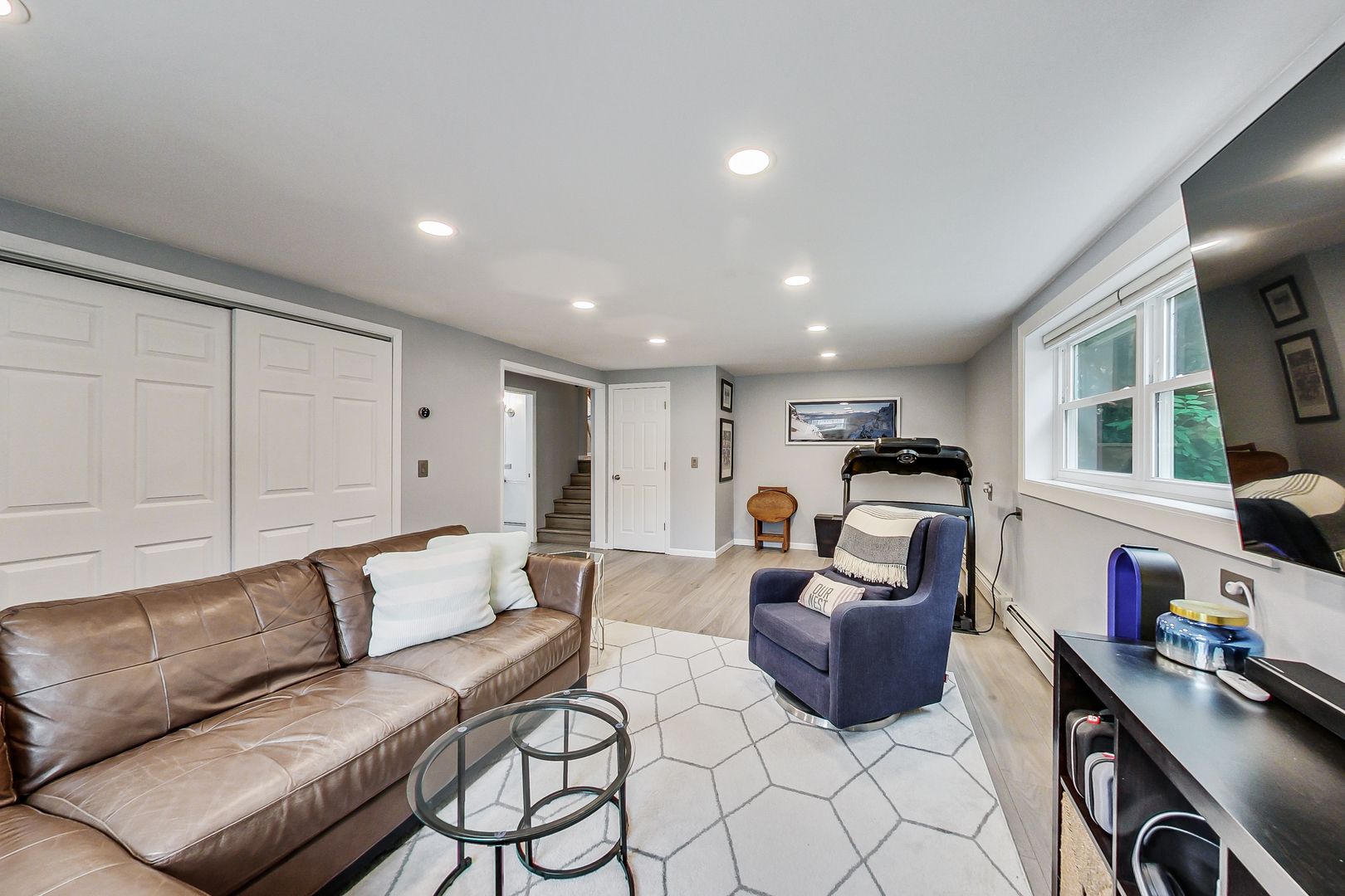 3609 North Harding Avenue Chicago, IL 60618 - Photo 26 of 41 a living room with furniture and a flat screen tv