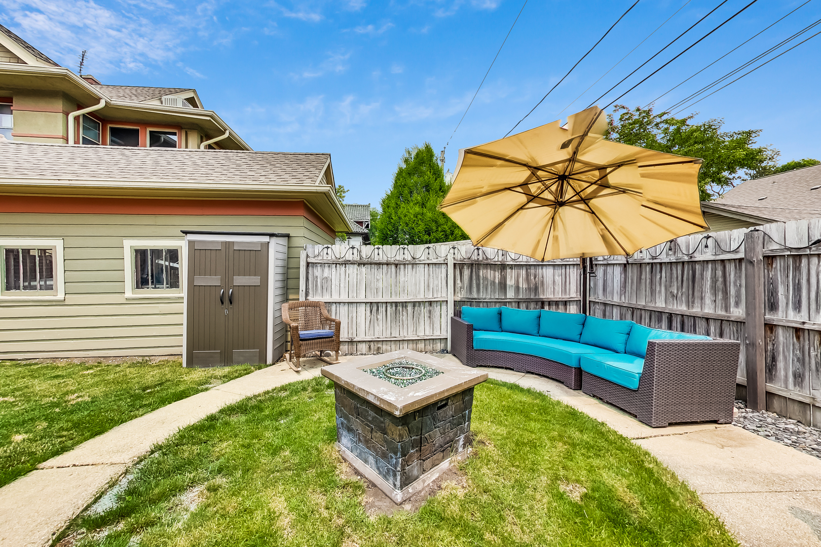 3609 North Harding Avenue Chicago, IL 60618 - Photo 34 of 41 a view of a backyard with a tub and chairs