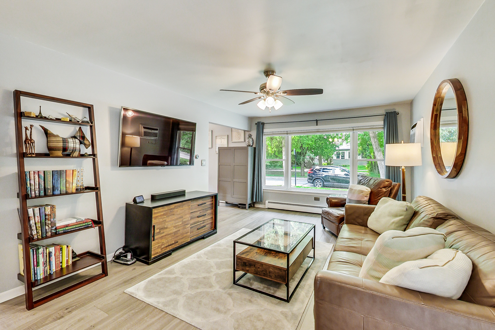 3609 North Harding Avenue Chicago, IL 60618 - Photo 4 of 41 a living room with furniture a flat screen tv and a large window
