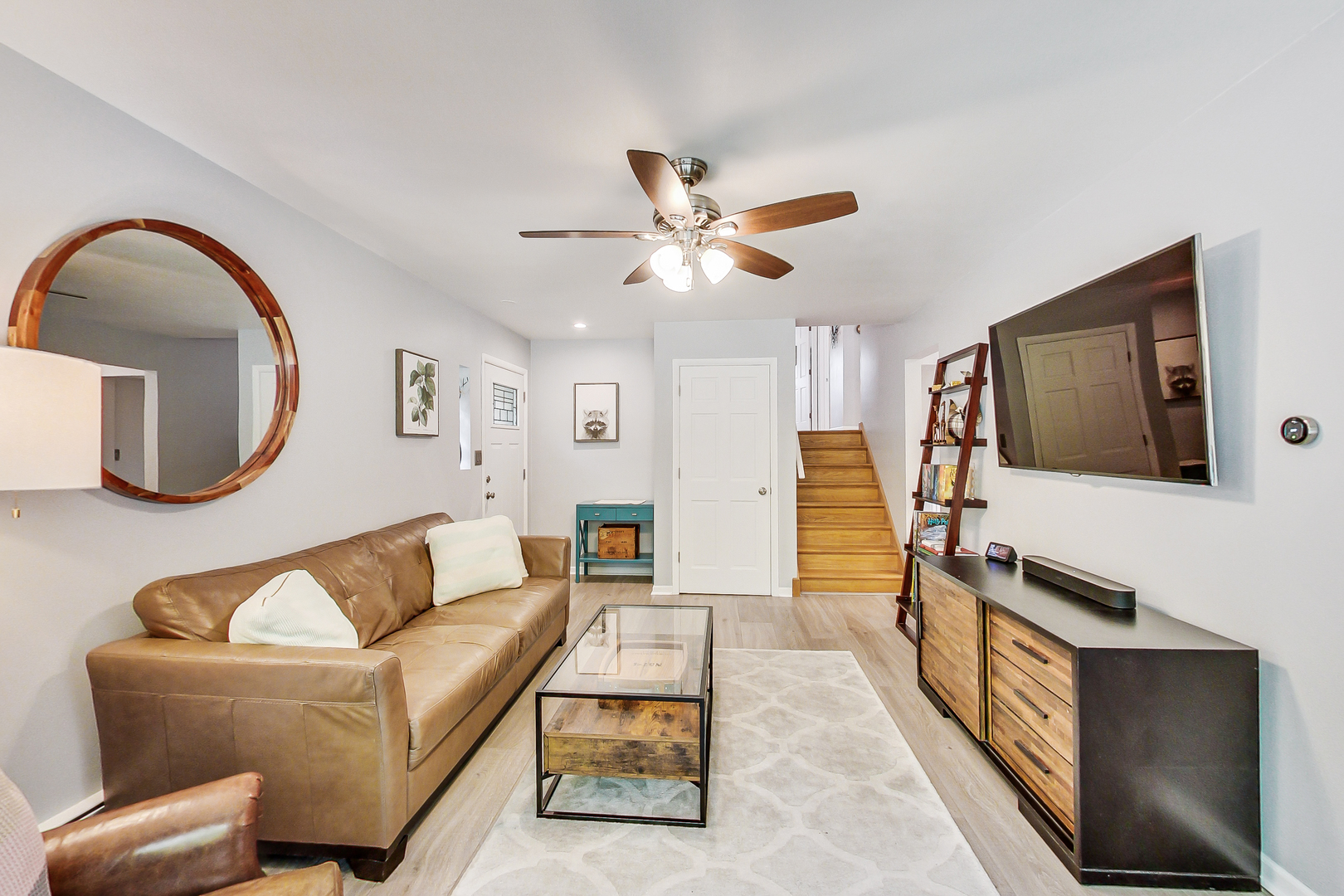 3609 North Harding Avenue Chicago, IL 60618 - Photo 5 of 41 a living room with furniture and a flat screen tv