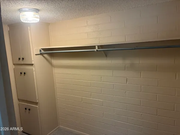 a bathroom with a shower and a sink
