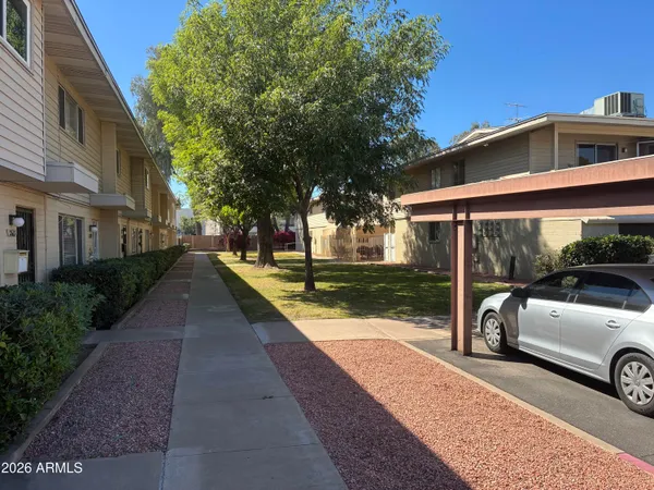 a view of a car parked in front of a building