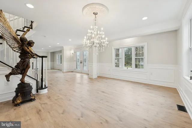 a very nice looking kitchen with a chandelier