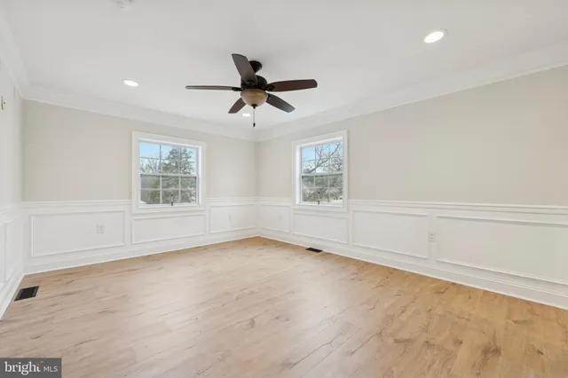 a spacious bedroom with a bed and a couch