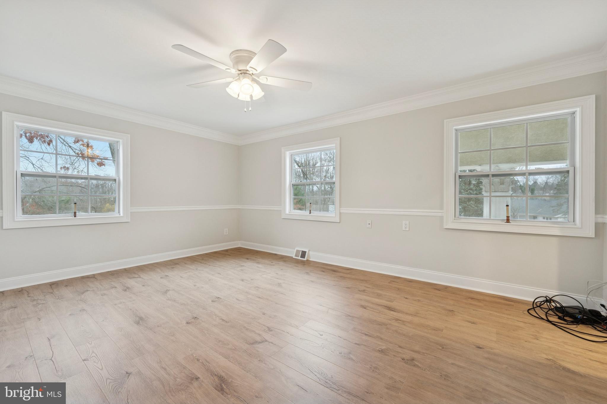 440 Rittenhouse Boulevard Jeffersonville, PA 19403 - Photo 29 of 45 a view of an empty room with a window and wooden floor