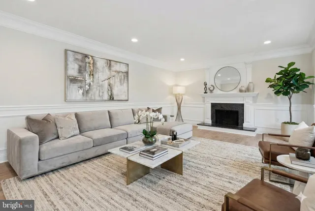 an empty room with wooden floor and fireplace