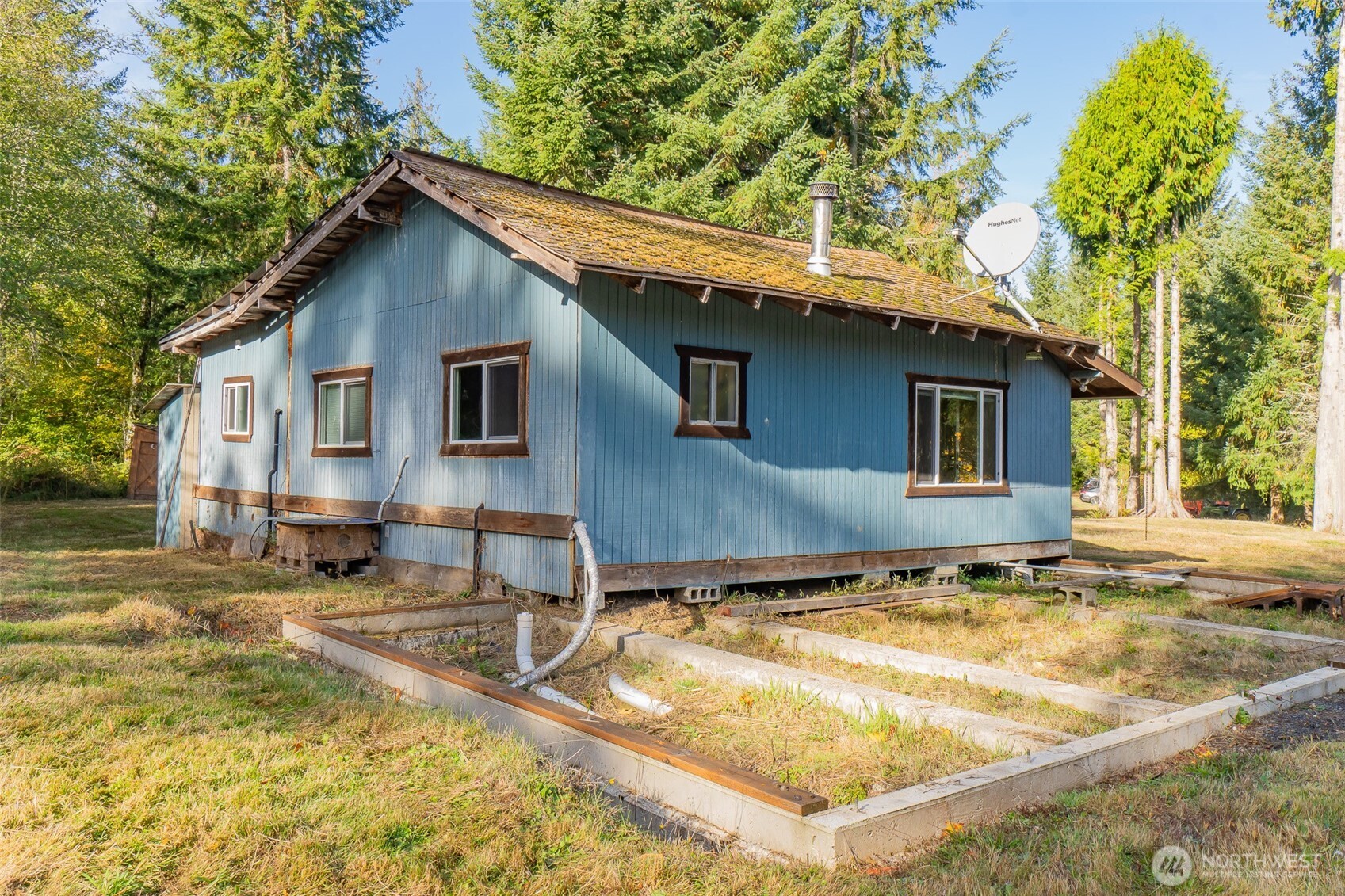 17328 Mulqueen Road Southeast Rainier, WA 98576 - Photo 14 of 38 a backyard of a house with seating space