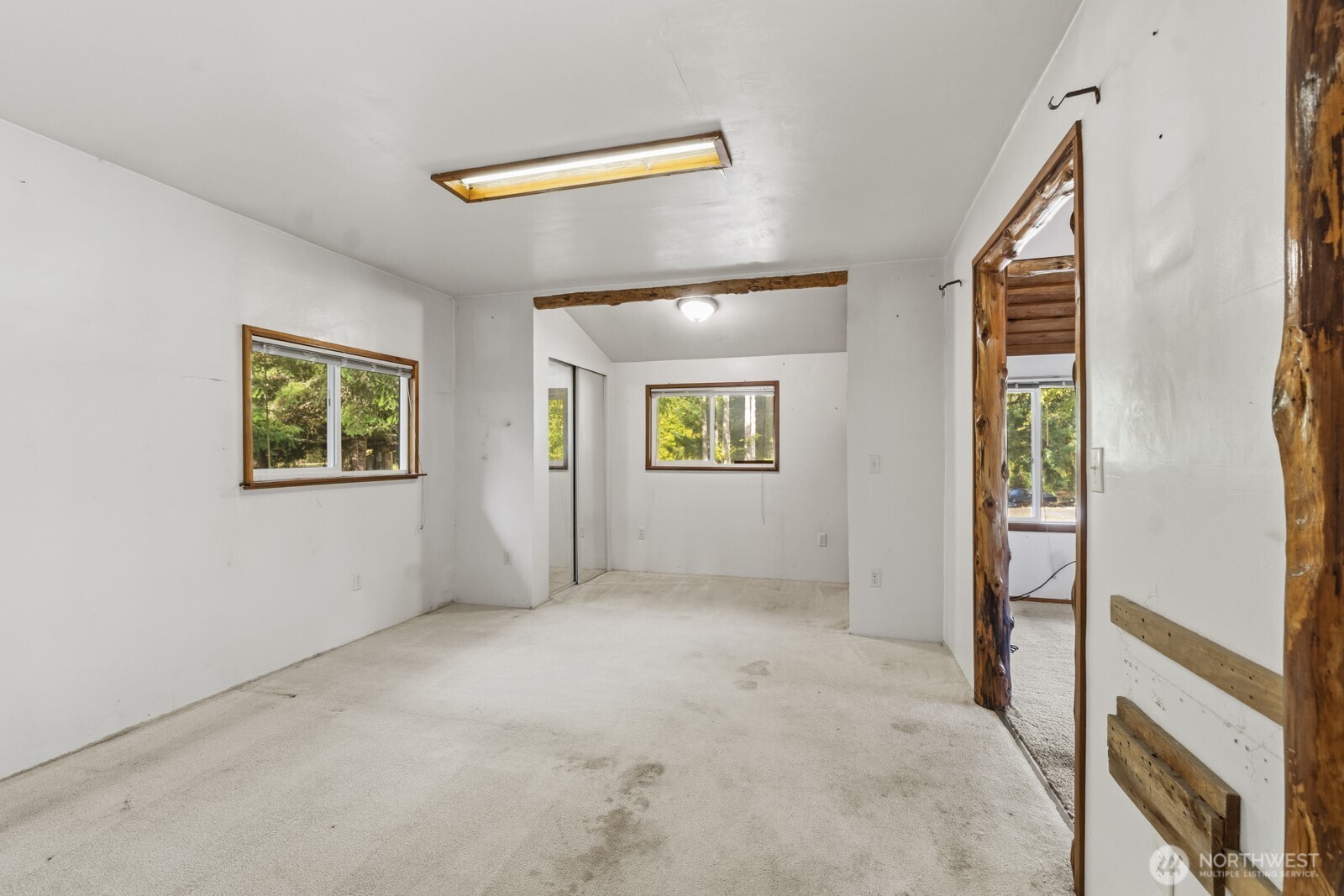17328 Mulqueen Road Southeast Rainier, WA 98576 - Photo 20 of 24 a view of an empty room with a window