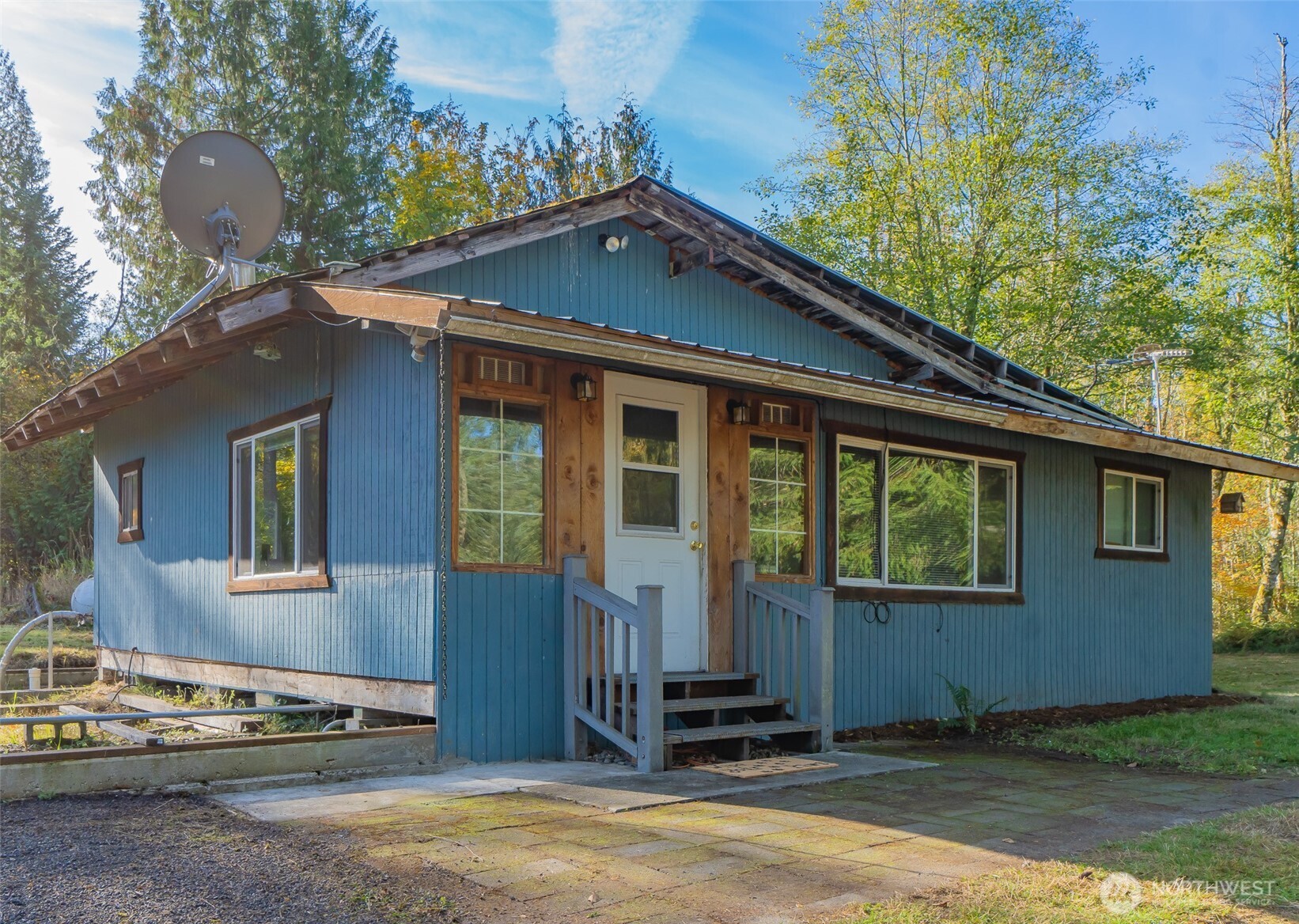 17328 Mulqueen Road Southeast Rainier, WA 98576 - Photo 2 of 24 a front view of a house with a yard