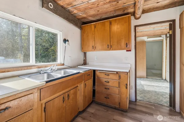a bathroom with a sink a mirror and a bathtub
