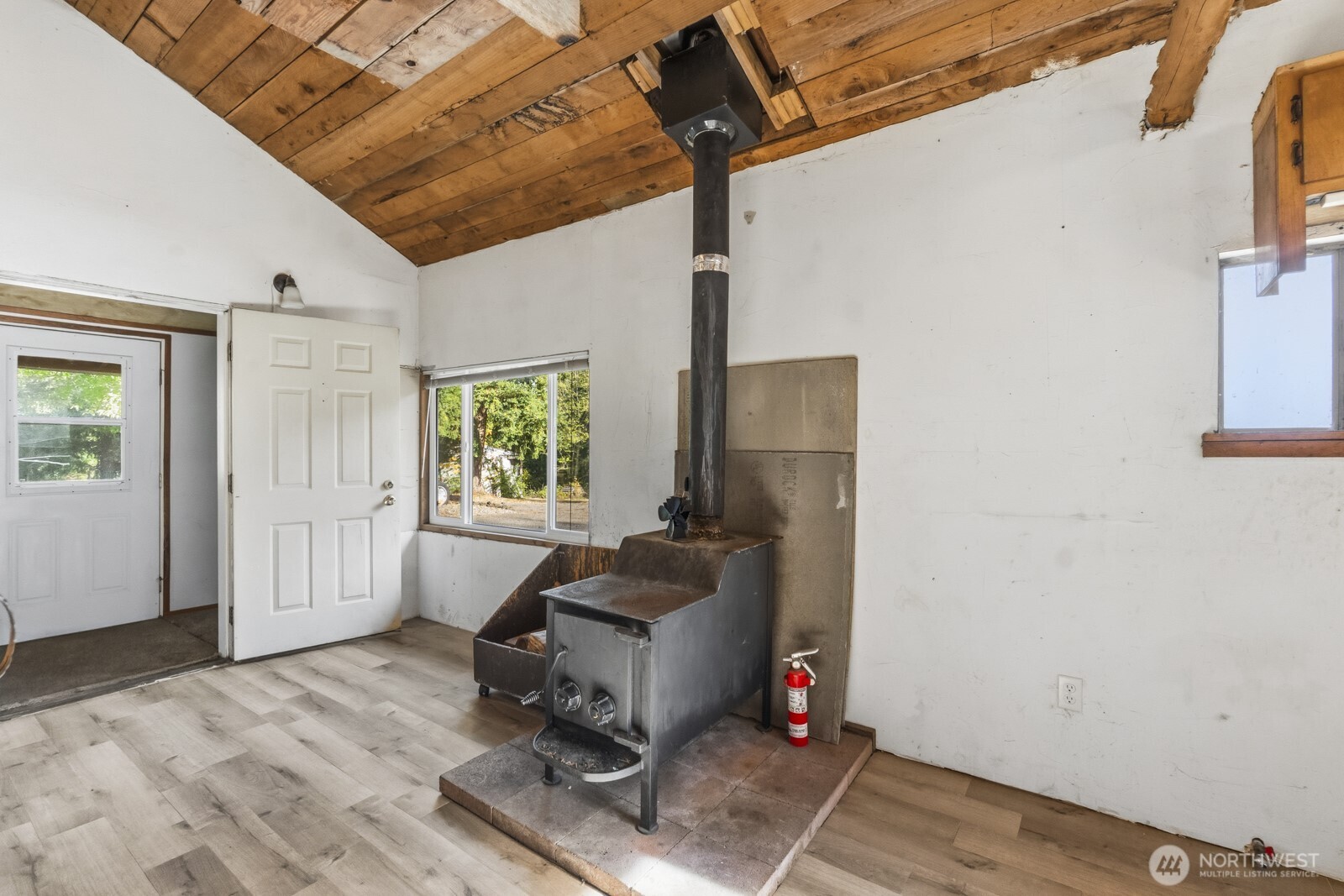 17328 Mulqueen Road Southeast Rainier, WA 98576 - Photo 35 of 38 a living room with furniture and a window