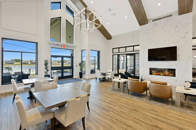 a living room with fireplace furniture and a flat screen tv