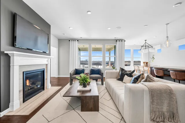 a living room with furniture fireplace and a flat screen tv