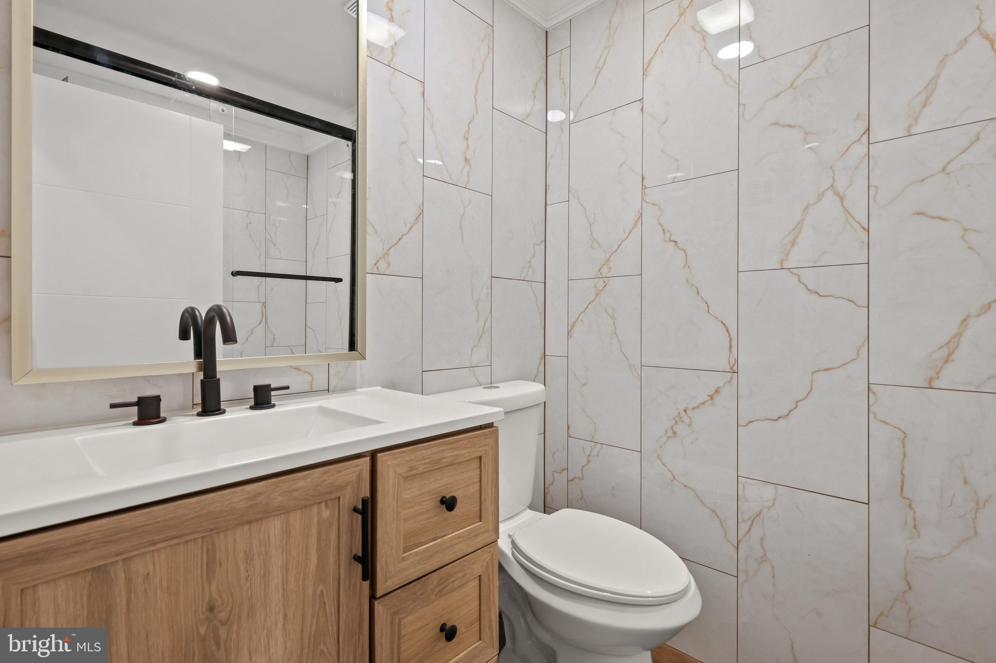 602 Wanamaker Road Jenkintown, PA 19046 - Photo 15 of 39 a bathroom with a toilet sink and mirror