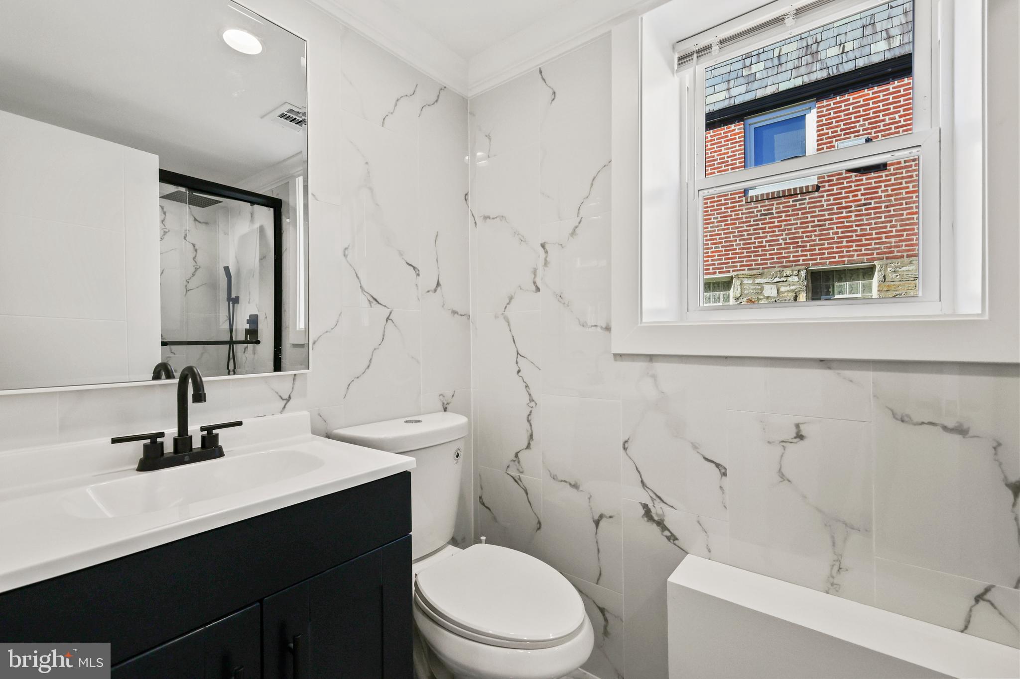 602 Wanamaker Road Jenkintown, PA 19046 - Photo 25 of 39 a bathroom with a sink a toilet and shower