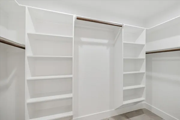 a view of an empty walk in closet