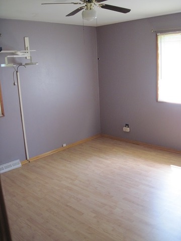 354 Cleveland Avenue Rochelle, IL 61068 - Photo 11 of 22 a view of an empty room with a window