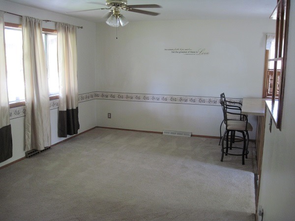 354 Cleveland Avenue Rochelle, IL 61068 - Photo 3 of 22 a view of an empty room with a window